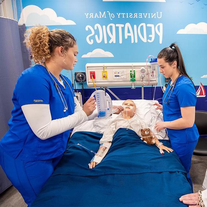 Students working in the Pediatrics simulation labs on campus.