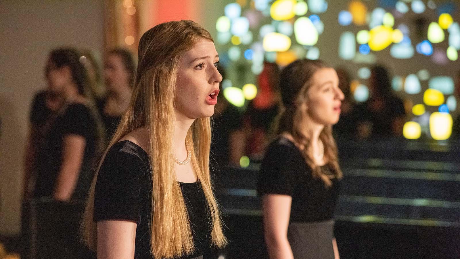 Two soloist performing in the Our Lady of the Annunciation Chapel at the annual Christmas at Mary concert