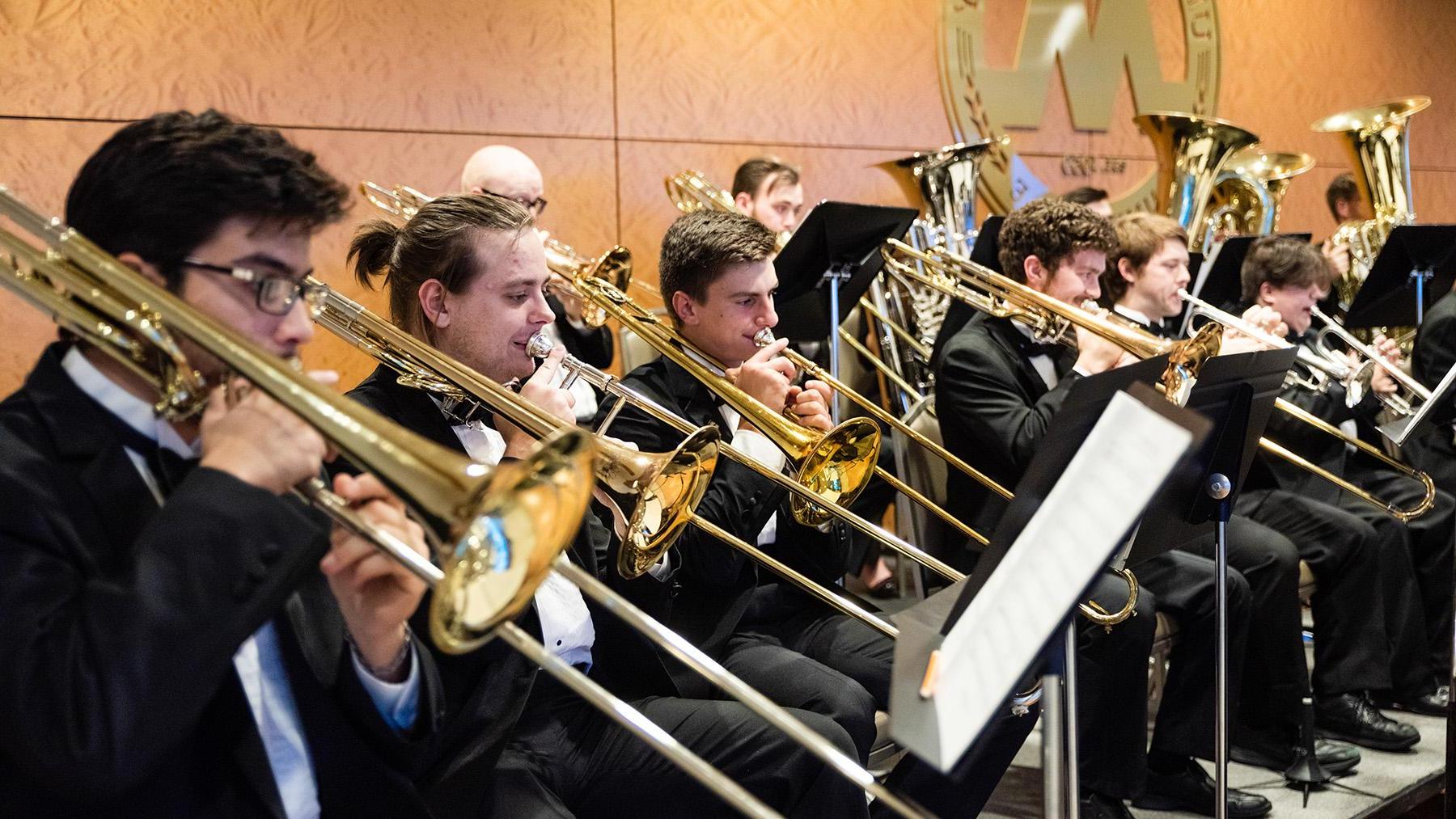 Band student playing the brass instruments